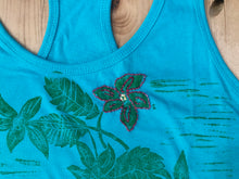 salmonberry flower hand embroidery on hand printed hummingbird design.  Cordova Alaska hand printed design