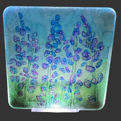 Decorative night light with lavender design on a textured wall background.  Lupine Flowers