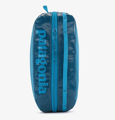 blue packing cube, black hole zippered bag